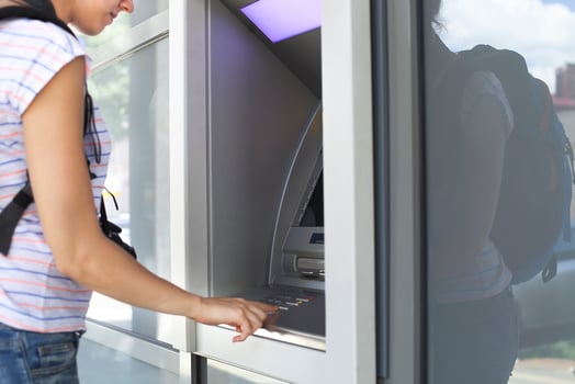 Woman using banking machine. photo
