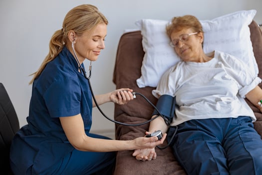 Doctor supporting a sick patient before medical procedures in a hospital room photo