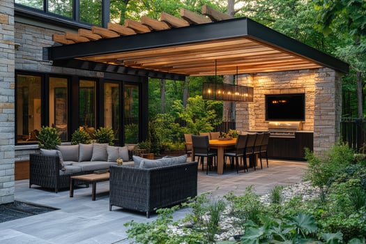Modern backyard with pergola illuminated at dusk with family enjoying dinner photo