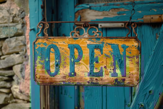 Old weathered rusty open sign hanging on a business door photo