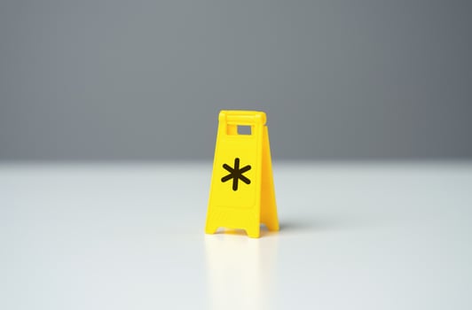 Warning sign with asterisk symbol conditions. Be careful with terms and conditions. Legal red tape and traps. Financial literacy, avoiding debt and not missing out on profits. Avoiding expenses fees photo