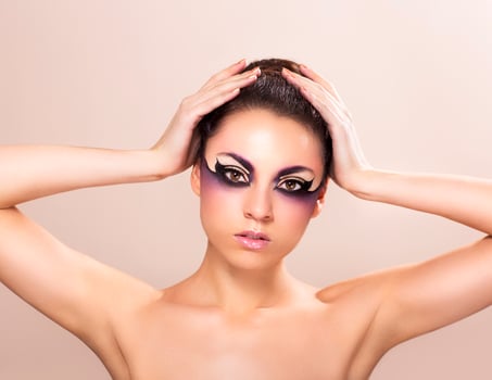 Beautiful young woman with fantasy makeup photo