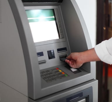 Man using banking machine photo