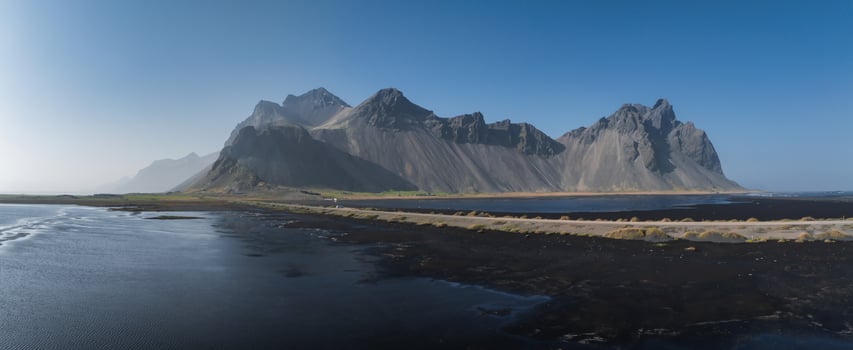 Stunning moody aerial landscape of mountain in Iceland. Impressive Colorful Seascape of Iceland. photo