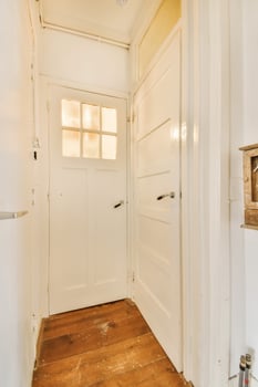 A white door with a window in the middle photo
