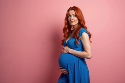 photo of pregnant woman surprise emotion standing on pink background,
