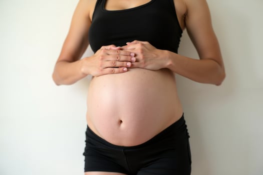 photo of close up shot pregnant woman on white background,