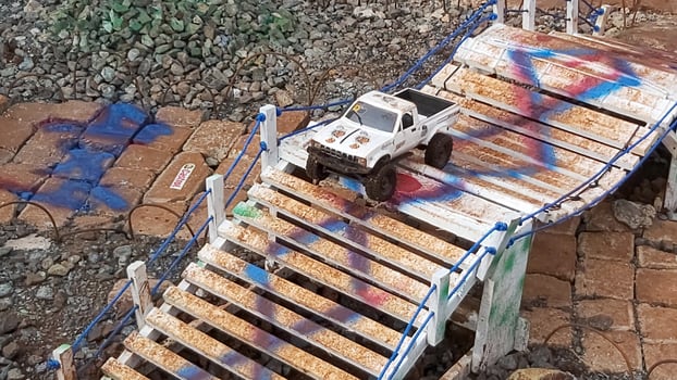 Radio controlled off road car model movement race quickly moving on the road photo