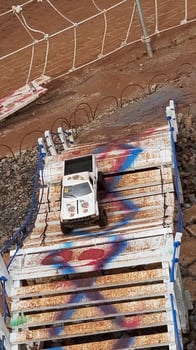 Radio controlled off road car model movement race quickly moving on the road photo