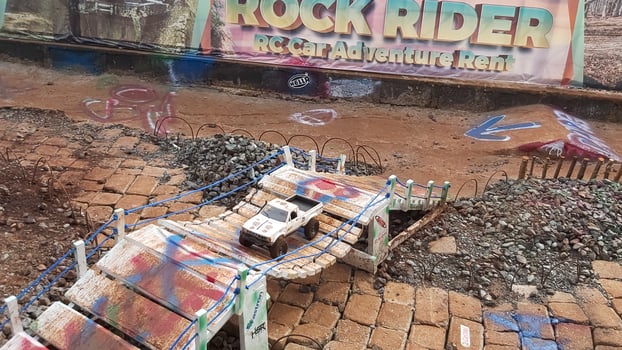 Radio controlled off road car model movement race quickly moving on the road photo