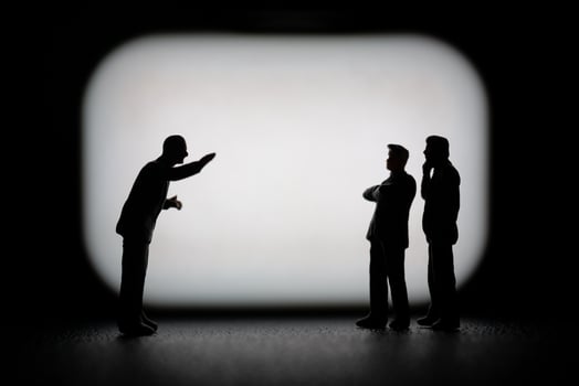 Miniature businessman in a professional agreement, with a blurred background to emphasize the interaction. photo
