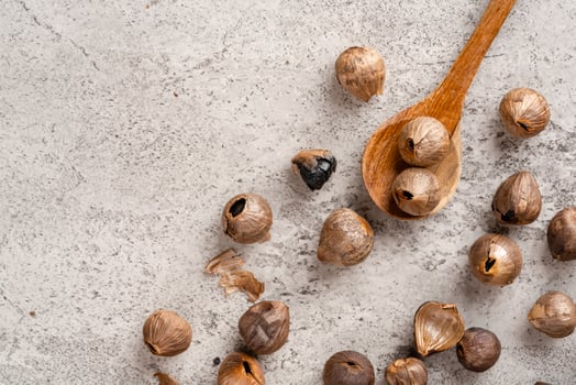 Fermented black garlic. The color is a result of the Maillard reaction or caramelization. Black garlic can help to regulate blood sugar levels photo