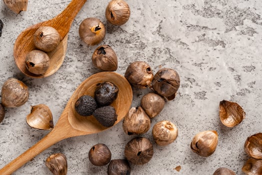 Fermented black garlic. The color is a result of the Maillard reaction or caramelization. Black garlic can help to regulate blood sugar levels photo