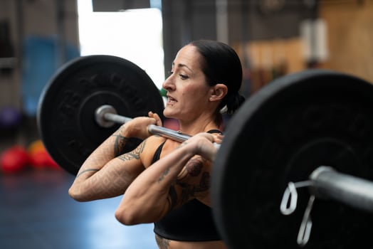 Bodybuilder working out in a cross training center photo
