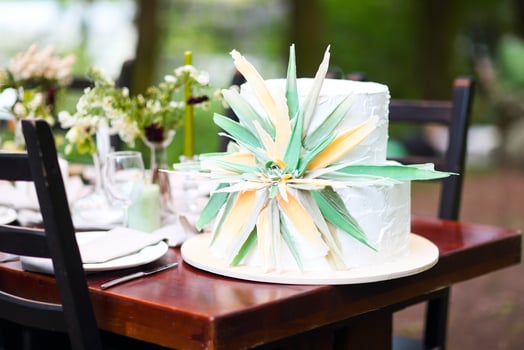 Beautiful wedding cake with flower on table photo