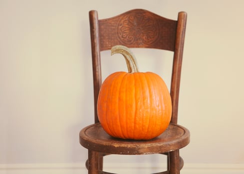 Halloween Pumpkin on a vintage chair photo