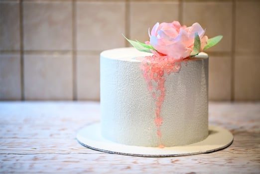 Wedding cake beautiful decorated with pink roses and sugar photo