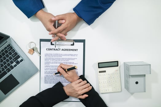 Real estate agent is talking to customer to present promotion for signing contract buy and selling real estate in company project in real estate office. present promotion to make customer decide buy. photo