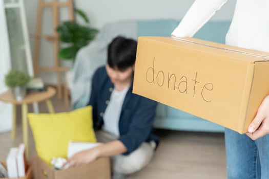 Moving house, relocation. Wife choose and pack for donate before move home, Couple help set and move furniture for new apartment. move in the new apartment or condominium, movement, belongings photo