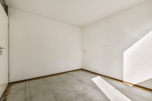 Empty room with white walls and a door photo
