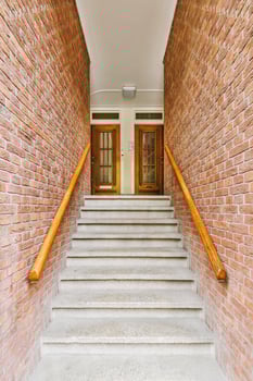 A stairway with a door and a railing photo