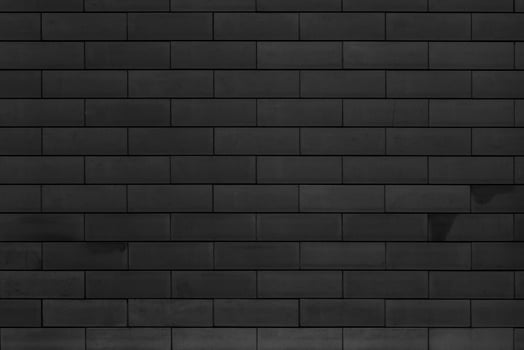 Brick wall of the building. Designer building background. photo