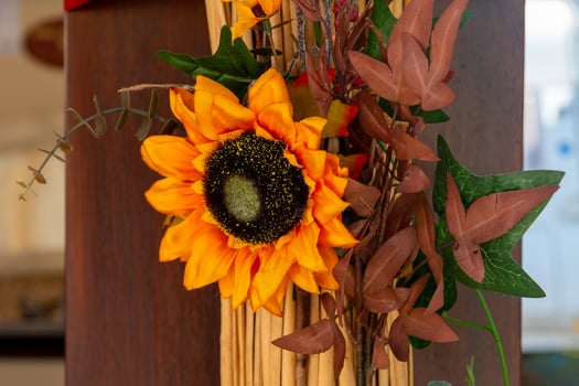 bouquet of flowers with a sunflower in the center photo
