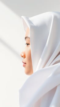 Close-up Portrait of a Woman Wearing a White Hijab photo