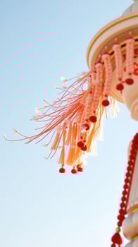 Red and Orange Tassels on a White Background photo