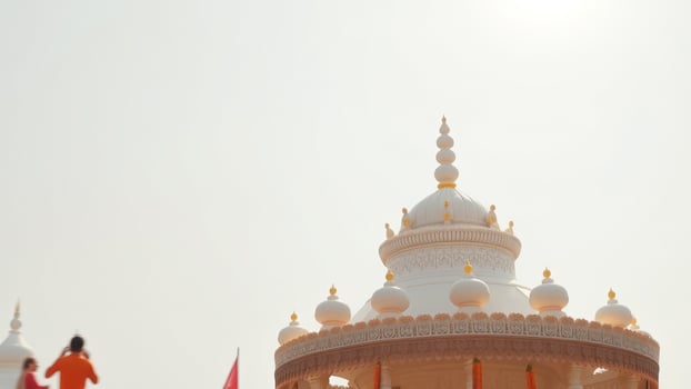 White Dome with Intricate Carvings Against a Bright Sky photo