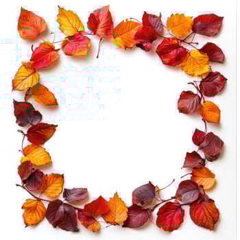 A vibrant autumn wreath made from colorful leaves and red berries arranged on a white background to celebrate the fall season photo