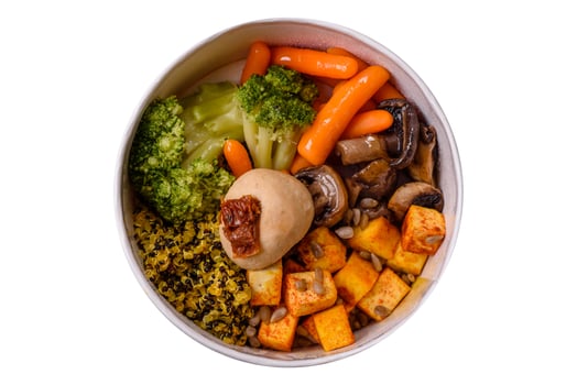 Colorful vegan vegetarian dish consists of tofu, broccoli, quinoa, mushrooms photo