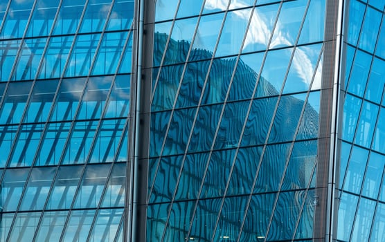 modern architectural background, glass and metal facade of contemporary building photo