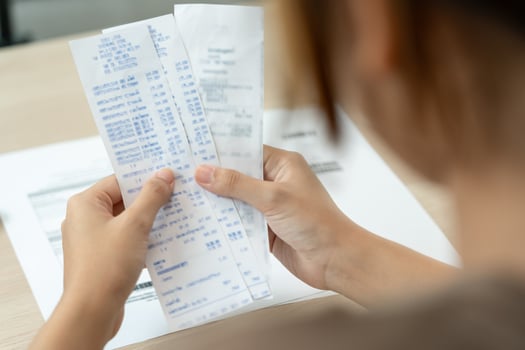 Stressed and headache woman with large bills or invoices no money to pay to expenses and credit card debt. shortage, Financial problem, bankruptcy, mortgage, loan, bankrupt, poor, empty wallet photo