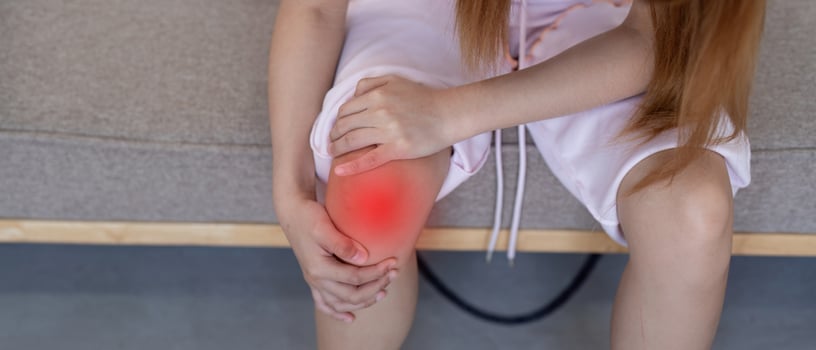 Young Woman Holding Painful Knee. Knee Pain and Discomfort photo