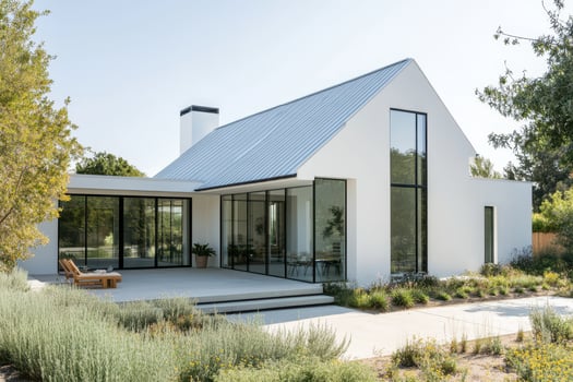 Modern minimalist house with large glass windows and a landscaped garden photo