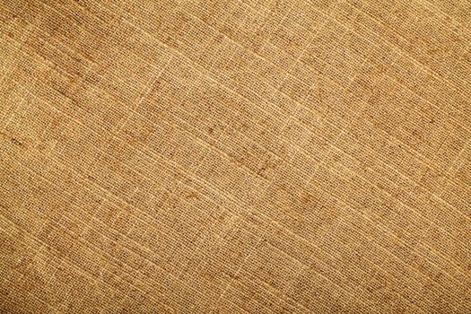 Natural Linen Material Textile Canvas Fabric Texture Background Close-up Detail of Fabric Natural Color Hemp Material Pattern Design Wallpaper. Can be Used as Background or For Graphic Design photo