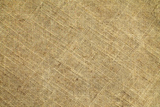 Natural Linen Material Textile Canvas Fabric Texture Background Close-up Detail of Fabric Natural Color Hemp Material Pattern Design Wallpaper. Can be Used as Background or For Graphic Design photo