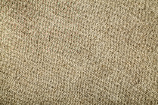 Natural Linen Material Textile Canvas Fabric Texture Background Close-up Detail of Fabric Natural Color Hemp Material Pattern Design Wallpaper. Can be Used as Background or For Graphic Design photo