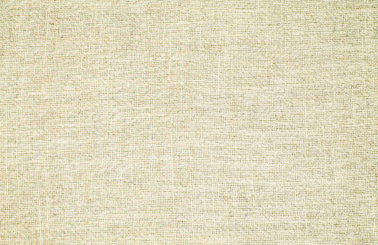 Natural Linen Material Textile Canvas Fabric Texture Background Close-up Detail of Fabric Natural Color Hemp Material Pattern Design Wallpaper. Can be Used as Background or For Graphic Design photo