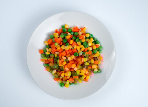 Organic Food. Mixed Vegetables Isolated White Background. Vegetable containing carrots, peas, and corn on white background, Healthy food, Colorful mixed vegetables. photo