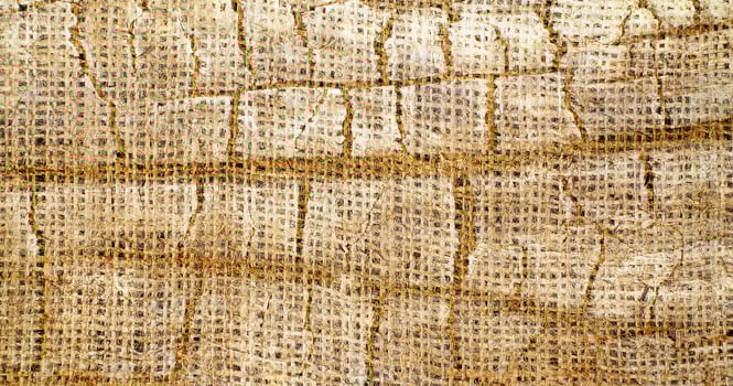 Natural Linen Material Textile Canvas Fabric Texture Background Close-up Detail of Fabric Natural Color Hemp Material Pattern Design Wallpaper. Can be Used as Background or For Graphic Design photo
