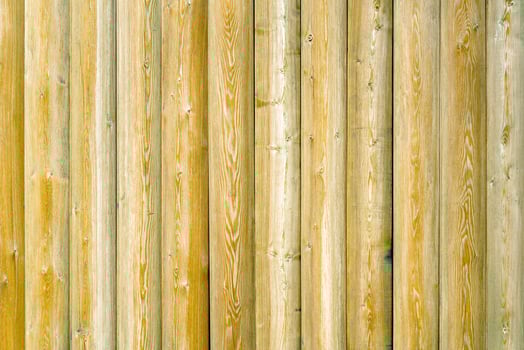 Vintage fence of old wooden boards. Texture of an aging wooden surface. Beautiful wooden background. photo