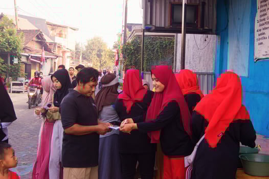 Gresik, Indonesia, 20 August 2023 - Portrait of residents going on a healthy walk together in a village photo