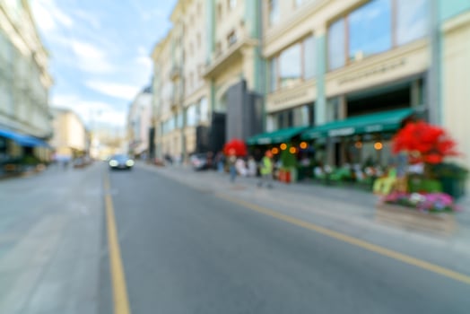 Blurred background of a city street. Blurred photo of a modern city.
