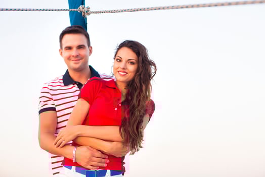 Young couple on a sailing boat at summer photo