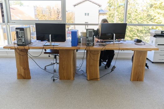 Modern Office Interior with Wooden Furniture, Conference Table, and Computers photo