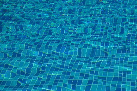Shining blue water ripple background photo