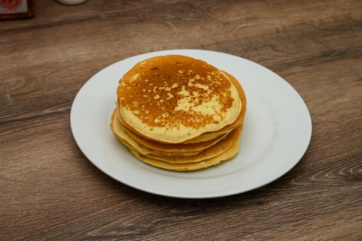 Delicious pancakes on a wooden table photo