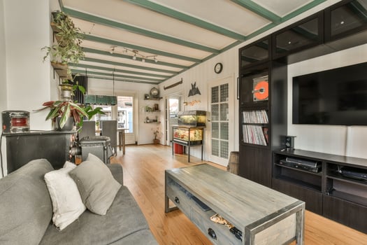 A living room with a couch, tv and a coffee table photo